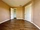 Bedroom with hardwood floors and closet with ample storage at 4350 Aqua Vista Dr # G, Orlando, FL 32839