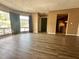 Cozy living room featuring a large window for natural light and views to the street, complemented by new wood flooring at 4350 Aqua Vista Dr # G, Orlando, FL 32839