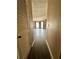 Hallway leads to the spacious living room with large bay window at 4350 Aqua Vista Dr # G, Orlando, FL 32839