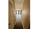 Hallway leads to the spacious living room with large bay window at 4350 Aqua Vista Dr # G, Orlando, FL 32839