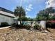 Community pool area surrounded by palms, cacti and black fencing on a sunny day at 4350 Aqua Vista Dr # G, Orlando, FL 32839