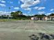 Community tennis courts with tall green trees in the background at 4350 Aqua Vista Dr # G, Orlando, FL 32839