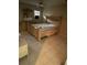 View of a furnished bedroom with a patterned mattress and wooden furniture at 7747 Pine Hawk Ln, Orlando, FL 32822