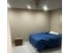 Bedroom featuring a simple bed and tile floor at 7747 Pine Hawk Ln, Orlando, FL 32822