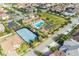 Community aerial view featuring a tennis court, pool, and green space at 8017 Chilton Dr, Orlando, FL 32836