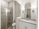 Clean and modern bathroom with glass shower and neutral colors at 8017 Chilton Dr, Orlando, FL 32836