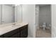 Bathroom with a single sink vanity, neutral countertops, and a toilet and shower at 8017 Chilton Dr, Orlando, FL 32836