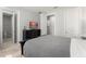 Bedroom featuring a TV, walk-in closet, and bathroom access at 8017 Chilton Dr, Orlando, FL 32836