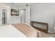 Bedroom features a wall art, and a bench with a view of a walk-in closet at 8017 Chilton Dr, Orlando, FL 32836