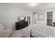 Well-lit bedroom with a bed and a flatscreen television on the dresser at 8017 Chilton Dr, Orlando, FL 32836