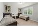 Bedroom featuring two beds, bedside tables, and natural light from the window at 8017 Chilton Dr, Orlando, FL 32836