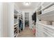 A large walk-in closet with custom shelving and drawers, providing ample storage space at 8017 Chilton Dr, Orlando, FL 32836