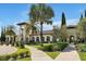 Beautiful clubhouse surrounded by lush landscaping and well-maintained walkways, offering a serene community setting at 8017 Chilton Dr, Orlando, FL 32836