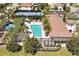An aerial view displays the community pool, tennis court, and green spaces at 8017 Chilton Dr, Orlando, FL 32836