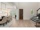 Elegant dining room with chandelier, plantation shutters, and easy access to the entryway at 8017 Chilton Dr, Orlando, FL 32836