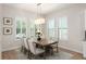 Inviting dining room with natural light, modern fixtures and comfortable seating at 8017 Chilton Dr, Orlando, FL 32836
