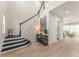Grand entryway with high ceilings, wood floors, staircase, and tasteful decor at 8017 Chilton Dr, Orlando, FL 32836