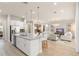 A modern open concept kitchen, dining, and living area, creating a bright and inviting space at 8017 Chilton Dr, Orlando, FL 32836