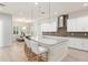 The island kitchen includes barstool seating and an open dining area creating a great space to entertain at 8017 Chilton Dr, Orlando, FL 32836