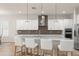 Gourmet kitchen features a large center island, stainless steel appliances and pendant lighting at 8017 Chilton Dr, Orlando, FL 32836