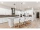 A large kitchen with a spacious island, bar seating, and stainless steel appliances, perfect for entertaining at 8017 Chilton Dr, Orlando, FL 32836