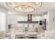 Open living room with pendant lighting and comfortable seating connects seamlessly to dining area at 8017 Chilton Dr, Orlando, FL 32836
