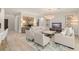 A comfortable and sophisticated living room with modern decor, beautiful art, and plenty of natural light at 8017 Chilton Dr, Orlando, FL 32836