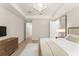 Cozy main bedroom with luxury bedding, and a nice view of the en suite bath at 8017 Chilton Dr, Orlando, FL 32836