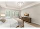 Elegant main bedroom with comfortable furnishings, scenic views, and modern lighting at 8017 Chilton Dr, Orlando, FL 32836