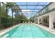 Outdoor pool with lounge chairs and an outdoor dining area at 8017 Chilton Dr, Orlando, FL 32836