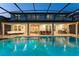 A luxurious pool with a screened enclosure and a view of the home's exterior at 8017 Chilton Dr, Orlando, FL 32836