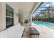 Outdoor seating area that overlooks an outdoor pool and spa at 8017 Chilton Dr, Orlando, FL 32836