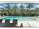 View of an outdoor pool with lounge chairs and a dining table at 8017 Chilton Dr, Orlando, FL 32836
