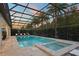 Gorgeous pool area featuring a spa, fountain features, and lush landscaping for ultimate outdoor enjoyment at 8017 Chilton Dr, Orlando, FL 32836