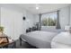 Well-lit bedroom with large window, carpet, closet, and a dark gray work space at 12651 Winding Woods Ln, Orlando, FL 32832