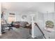 Relaxing upstairs loft featuring cozy seating, workspace, and a staircase with natural light at 12651 Winding Woods Ln, Orlando, FL 32832