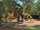 Community playground offering a variety of play structures, slides, and climbing features for enjoyment at 12651 Winding Woods Ln, Orlando, FL 32832