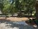 A charming community playground shaded by mature trees, offering a fun and safe environment for children at 12651 Winding Woods Ln, Orlando, FL 32832