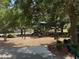 Community playground with a slide, swing, and climbing structure providing a safe and fun area for children at 12651 Winding Woods Ln, Orlando, FL 32832
