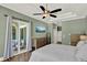 The bedroom includes a private access to the covered outdoor living space at 13710 Lake Cawood Dr, Windermere, FL 34786