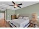 Spacious bedroom featuring a ceiling fan, en-suite bath, and generous natural light at 13710 Lake Cawood Dr, Windermere, FL 34786