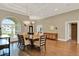 Spacious dining room featuring hardwood floors, chandelier, and a decorative console at 13710 Lake Cawood Dr, Windermere, FL 34786