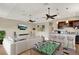 Spacious living room featuring a wet bar, game table, comfortable sofa, and entertainment center at 13710 Lake Cawood Dr, Windermere, FL 34786