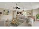 Bright and airy living room showcasing a comfortable sofa, modern decor, and a stylish wet bar at 13710 Lake Cawood Dr, Windermere, FL 34786