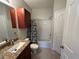 Full bathroom with cherry vanity, granite countertop, and tub with shower at 1420 Lake Shadow Cir # 9207, Maitland, FL 32751
