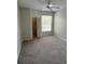 Neutral bedroom featuring carpet, ceiling fan, a large window, and a closet at 1420 Lake Shadow Cir # 9207, Maitland, FL 32751