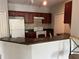 A well-equipped kitchen featuring granite countertops, and stainless appliances at 1420 Lake Shadow Cir # 9207, Maitland, FL 32751