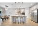 Open concept kitchen featuring granite countertops, stainless appliances, dining area, and ample storage at 14883 Golden Sunburst Ave, Orlando, FL 32827