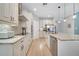 Well-equipped kitchen featuring stainless appliances, ample counter space, and modern lighting fixtures at 14883 Golden Sunburst Ave, Orlando, FL 32827