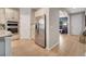 Modern kitchen featuring stainless steel appliances, granite countertops, and ample cabinet space at 14883 Golden Sunburst Ave, Orlando, FL 32827
